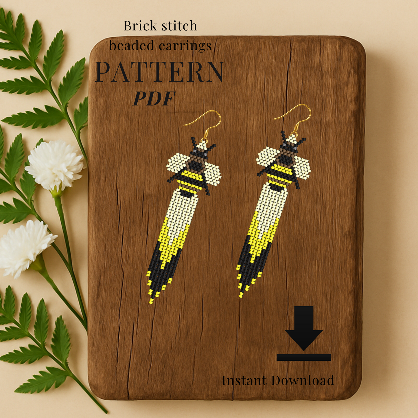Bee Brick stitch beaded earrings on a wooden board with floral elements.