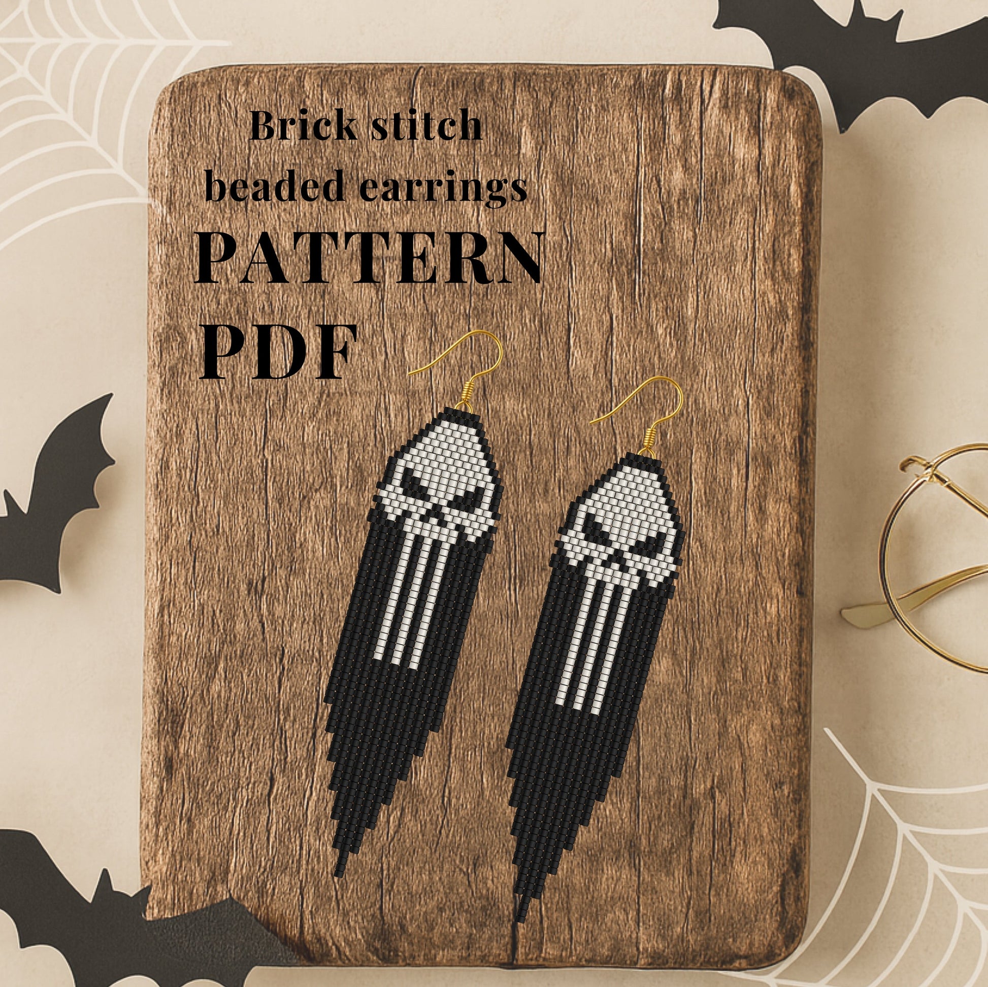 Brick stitch beaded earrings  pattern on a wooden board with 'Pattern PDF' text, surrounded by Halloween decorations.