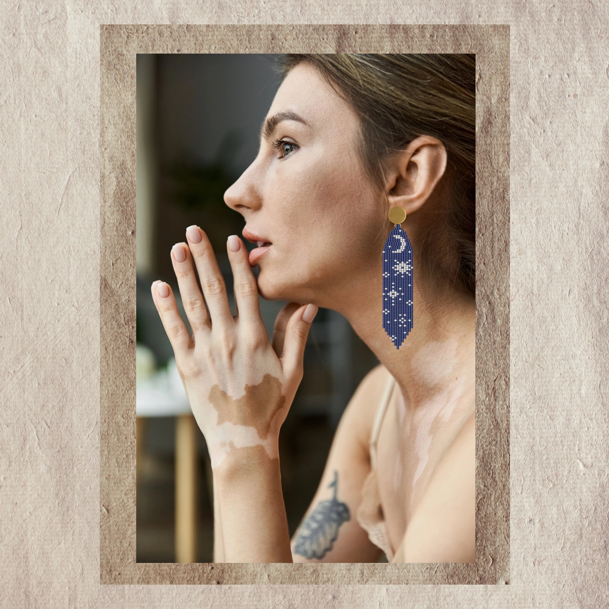 Woman wearing blue Moon phase earrings 