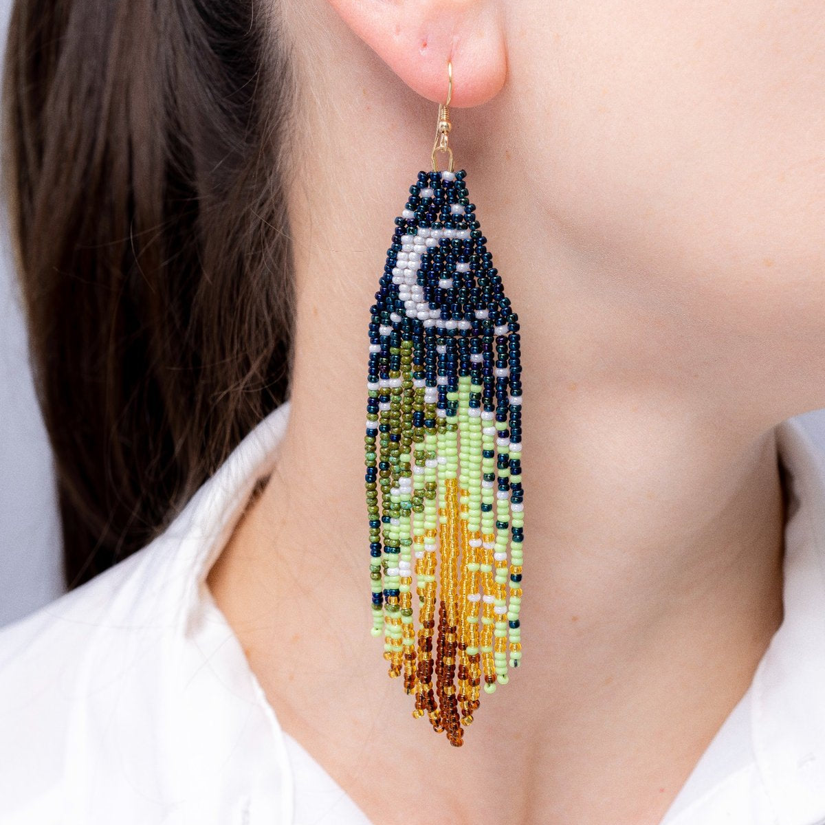 finished  Christmas earrings on the model