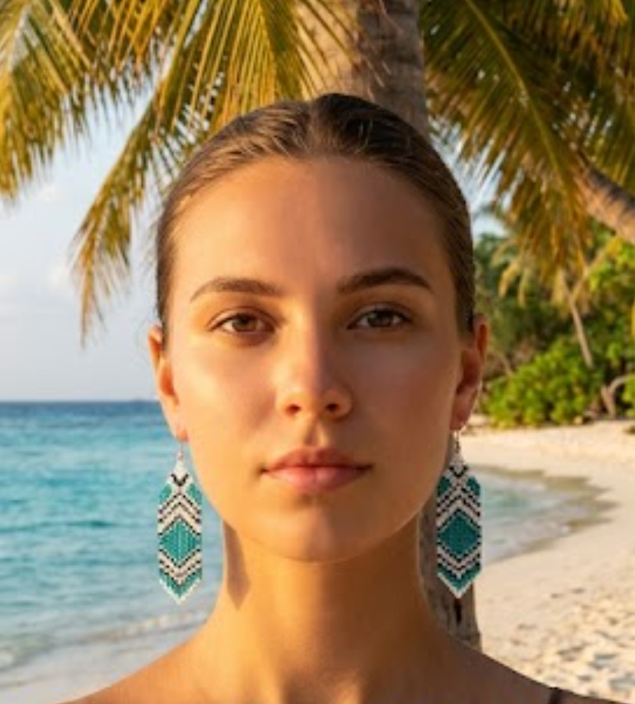 Woman with bohemian  earrings on a beach  