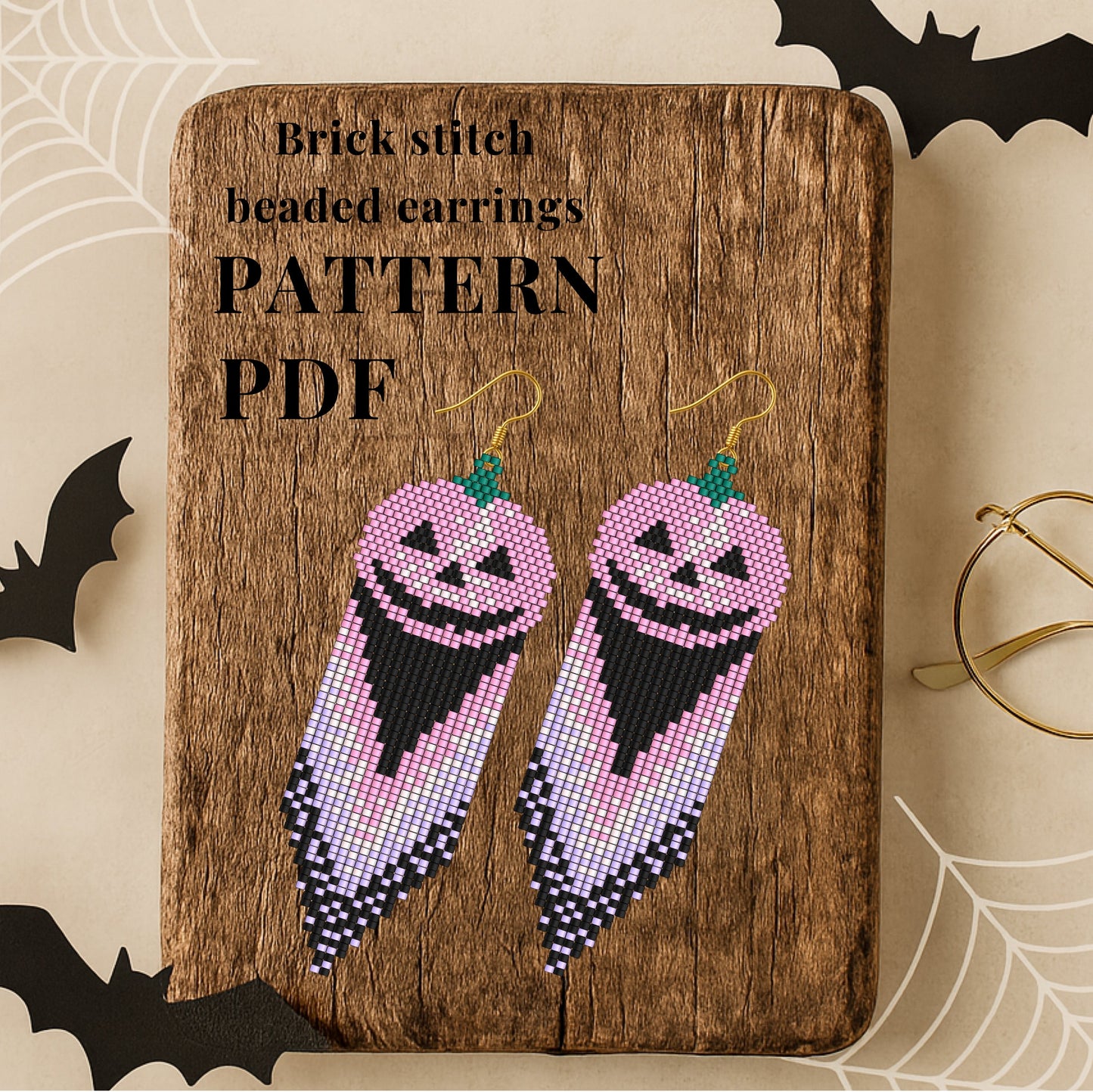 Brick stitch beaded pumpkin earrings on a wooden board with 'Pattern PDF' text, surrounded by Halloween decorations.