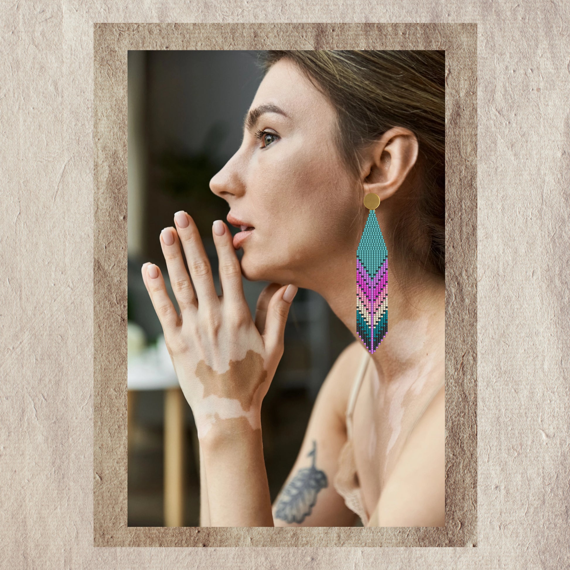 Woman wearing colorful  emerald earrings 