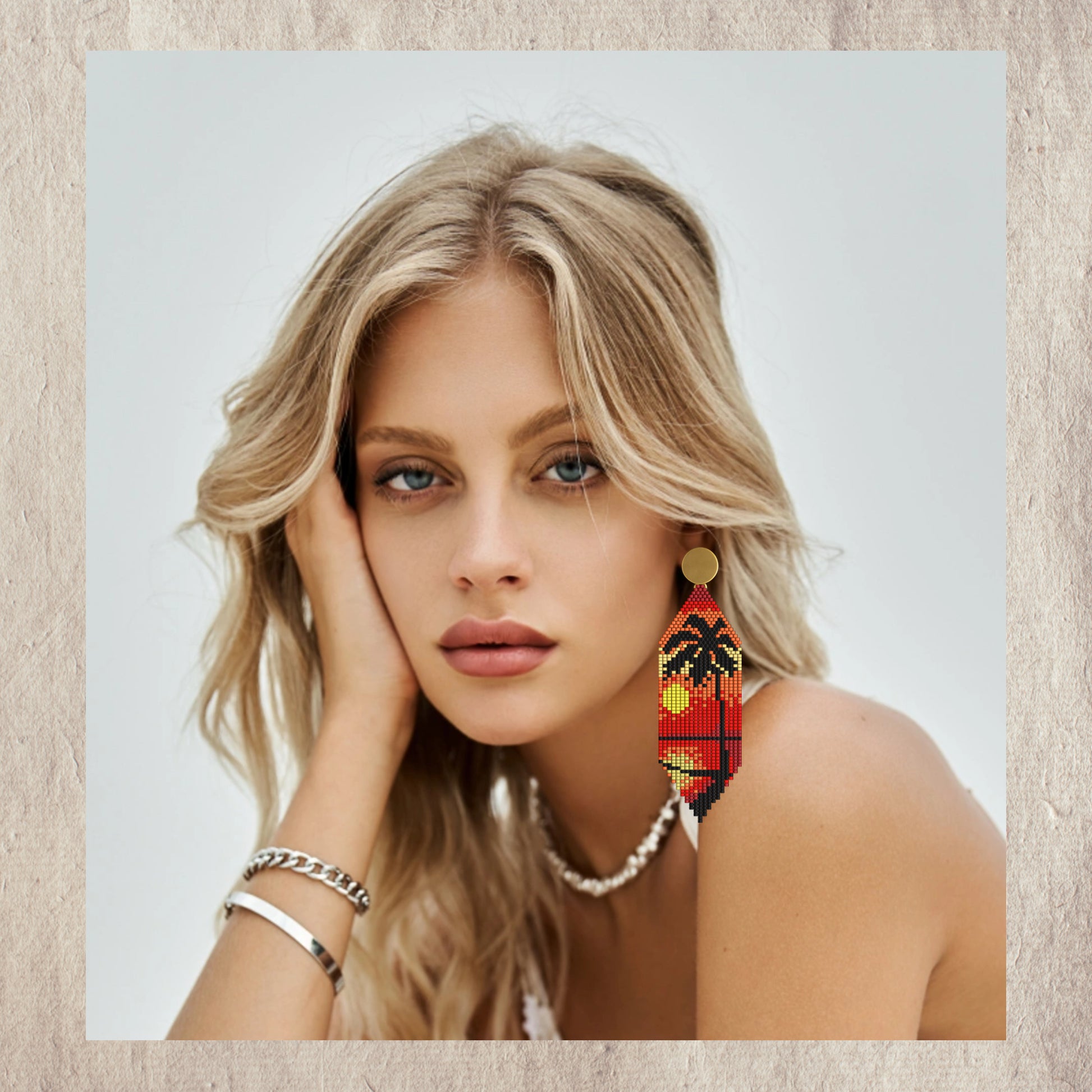 Woman wearing colorful  sunrise earrings with a neutral background
